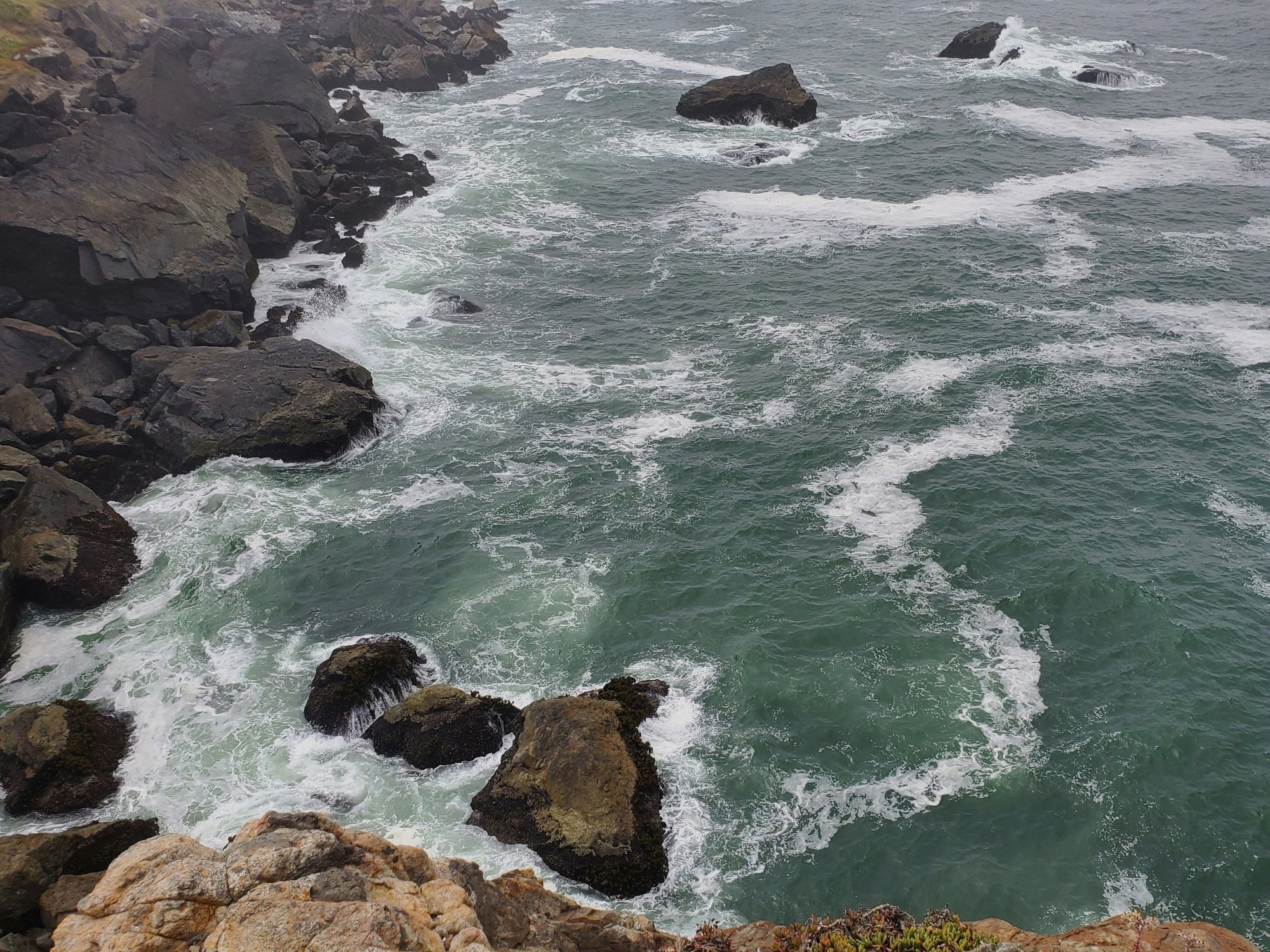 Rocky Maine coastline with rough seas