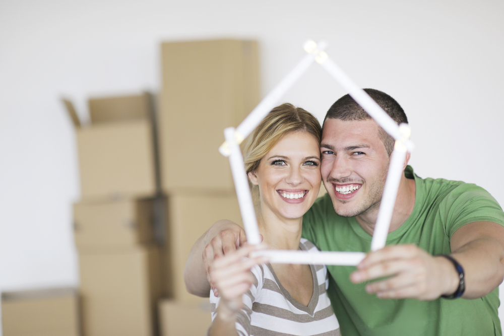 happy Young couple moving in new home